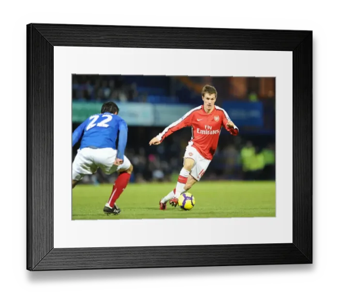 Framed Print : Aaron Ramsey (Arsenal) Richard Hughes (Portsmouth). Portsmouth 1: 4 Arsenal Framed Print : Aaron Ramsey (Arsenal) Richard Hughes (Portsmouth). Portsmouth 1: 4 Arsenal