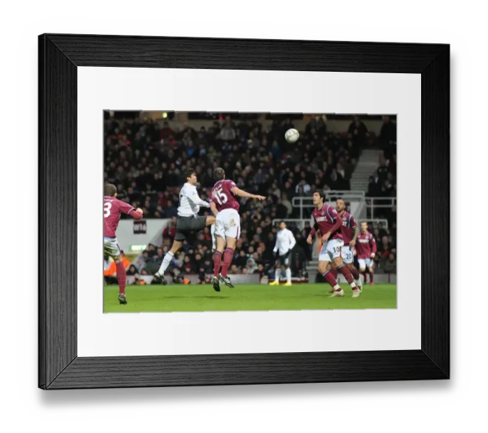 Framed Print : Eduardo heads past Matthew Upson and goalkeeper Rob Green to score the 2nd Arsenal goal