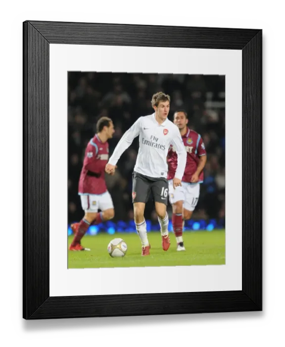 Framed Print : Aaron Ramsey Scores the Winning Goal: Arsenal Triumphs over West Ham United in FA Cup Third Round Framed Print : Aaron Ramsey Scores the Winning Goal: Arsenal Triumphs over West Ham United in FA Cup Third Round