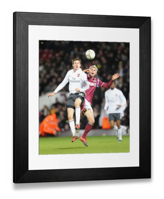 Framed Print : Aaron Ramsey (Arsenal) Valon Behrami (West Ham). West Ham United 1: 2 Arsenal