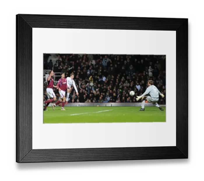 Framed Print : Aaron Ramsey shoots past West Ham goalkeeper Rob Green to score the 1st Arsenal goal