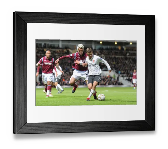 Framed Print : Jack Wilshere (Arsenal) Valon Behrami (West Ham). West Ham United 1: 2 Arsenal Framed Print : Jack Wilshere (Arsenal) Valon Behrami (West Ham). West Ham United 1: 2 Arsenal