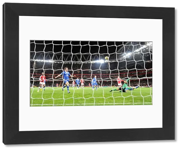 Tomas Rosicky shoots past Everton goalkeeper Tim Howard to score the 2nd Arsenal goal