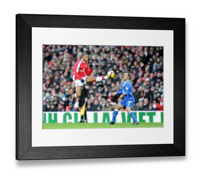 Framed Print : Armand Traore (Arsenal) Landon Dovovan (Everton). Arsenal 2: 2 Everton, Barclays Premier League