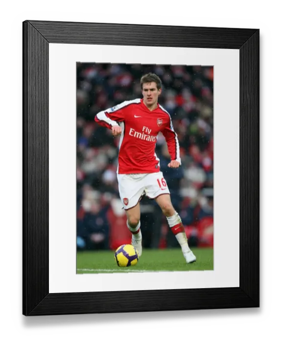 Framed Print : Aaron Ramsey (Arsenal). Arsenal 2: 2 Everton. Barclays Premier League. Emirates Stadium