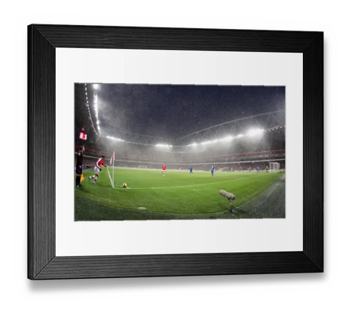 Framed Print : Snow falls during the match at Emirates. Arsenal 2: 2 Everton. Barclays Premier League Framed Print : Snow falls during the match at Emirates. Arsenal 2: 2 Everton. Barclays Premier League