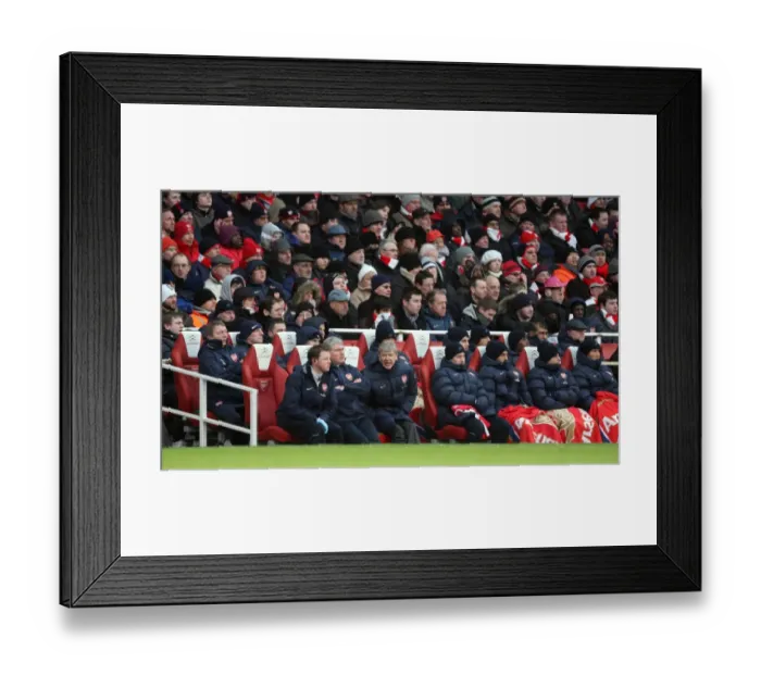 Framed Print : Arsene Wenger the Arsenal Manager sits in the dug out. Arsenal 2: 2 Everton