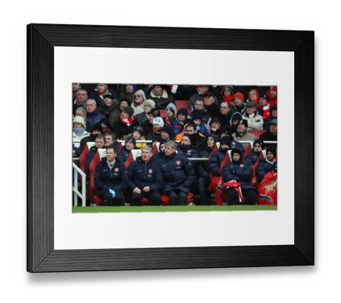 Framed Print : Arsene Wenger the Arsenal Manager sits in the dug out with Pat Rice (Assistant) Framed Print : Arsene Wenger the Arsenal Manager sits in the dug out with Pat Rice (Assistant)