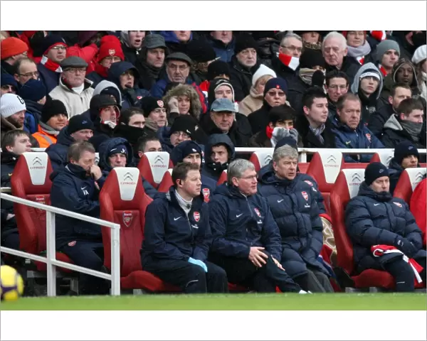 Arsene Wenger the Arsenal Manager sits with Colin Lewin (Physio) and Pat Rice