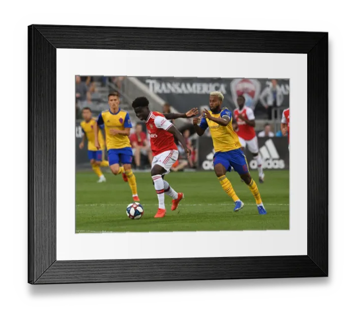 Framed Print : Arsenal's Bukayo Saka Goes Head-to-Head with Colorado Rapids Kellyn Acosta in Pre-Season Clash Framed Print : Arsenal's Bukayo Saka Goes Head-to-Head with Colorado Rapids Kellyn Acosta in Pre-Season Clash
