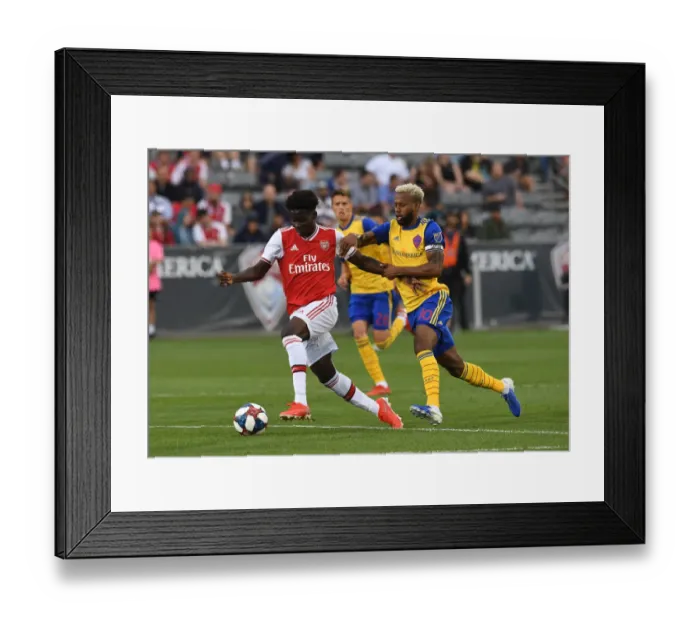 Framed Print : Arsenal's Bukayo Saka Goes Head-to-Head with Colorado Rapids Kellyn Acosta in Pre-Season Clash Framed Print : Arsenal's Bukayo Saka Goes Head-to-Head with Colorado Rapids Kellyn Acosta in Pre-Season Clash