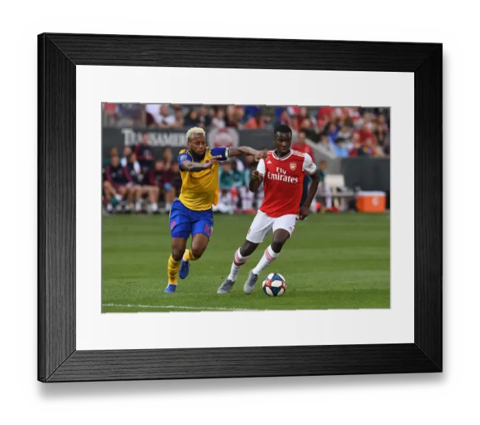 Framed Print : Arsenal's Eddie Nketiah vs. Colorado's Kellyn Acosta: A Pre-Season Showdown Framed Print : Arsenal's Eddie Nketiah vs. Colorado's Kellyn Acosta: A Pre-Season Showdown