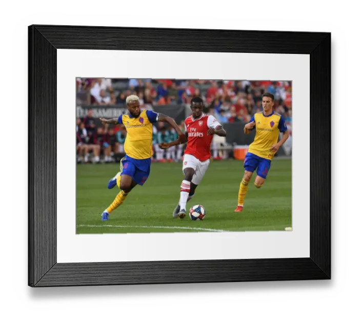 Framed Print : Nketiah vs. Acosta: A Clash of Talents in Arsenal's Pre-Season Match against Colorado Rapids Framed Print : Nketiah vs. Acosta: A Clash of Talents in Arsenal's Pre-Season Match against Colorado Rapids