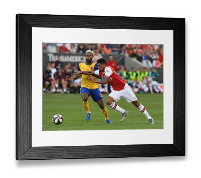 Framed Print : Arsenal's Tyreece John-Jules Goes Head-to-Head with Colorado Rapids Kellyn Acosta in Pre-Season Clash Framed Print : Arsenal's Tyreece John-Jules Goes Head-to-Head with Colorado Rapids Kellyn Acosta in Pre-Season Clash