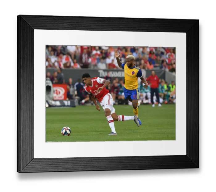 Framed Print : Arsenal's Tyreece John-Jules Faces Off Against Colorado Rapids Kellyn Acosta in 2019 Pre-Season Clash