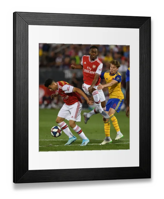 Framed Print : Arsenal FC vs Colorado Rapids: Intense Clash Between Gabriel Martinelli and Johan Blomberg Framed Print : Arsenal FC vs Colorado Rapids: Intense Clash Between Gabriel Martinelli and Johan Blomberg