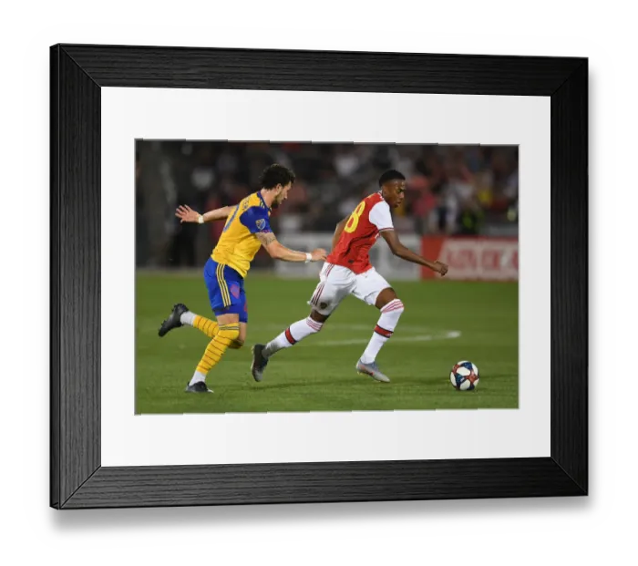 Framed Print : Arsenal's Joe Willock Clashes with Colorado Rapids Jordan Schweitzer in 2019 Pre-Season Match Framed Print : Arsenal's Joe Willock Clashes with Colorado Rapids Jordan Schweitzer in 2019 Pre-Season Match