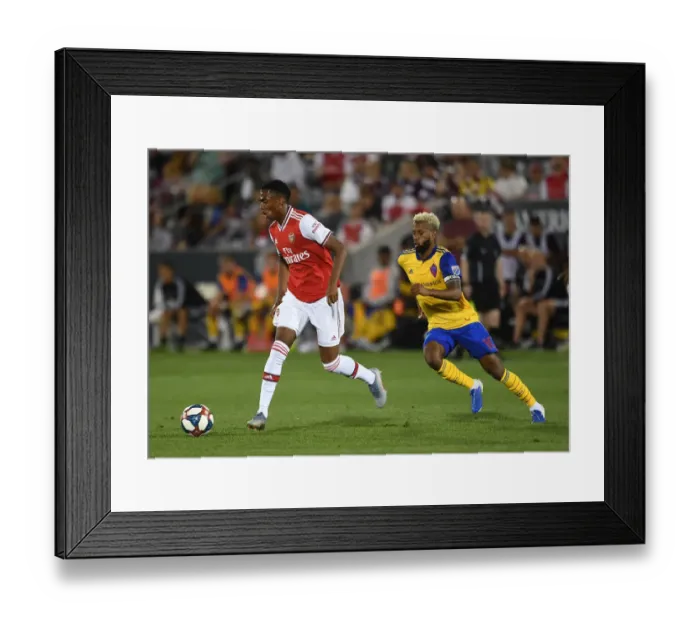 Framed Print : Arsenal's Joe Willock Goes Head-to-Head with Colorado Rapids Kellyn Acosta in Pre-Season Clash Framed Print : Arsenal's Joe Willock Goes Head-to-Head with Colorado Rapids Kellyn Acosta in Pre-Season Clash