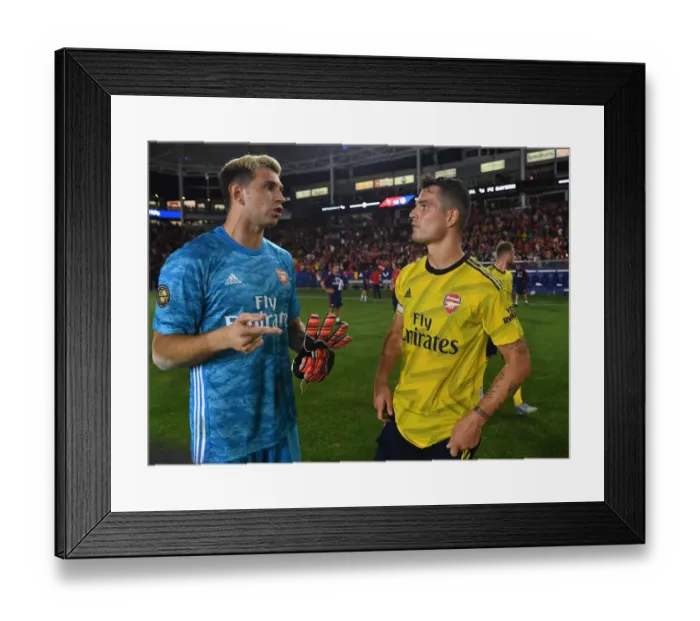 Framed Print : Arsenal Pre-Season: A Heartfelt Moment Between Emi Martinez and Granit Xhaka After Arsenal vs. Bayern Munich