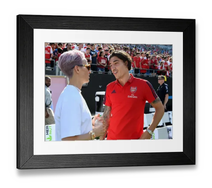 Framed Print : Arsenal's Bellerin Mingles with Megan Rapinoe of Reign FC during Arsenal v Fiorentina Match in Charlotte