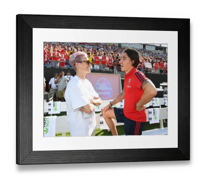 Framed Print : Arsenal's Bellerin Meets Megan Rapinoe of Reign FC during Arsenal v Fiorentina Match (2019) Framed Print : Arsenal's Bellerin Meets Megan Rapinoe of Reign FC during Arsenal v Fiorentina Match (2019)