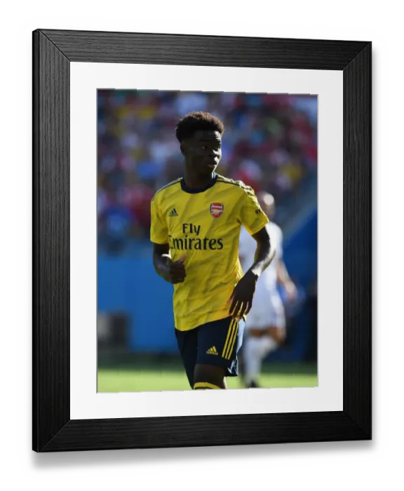 Framed Print : Bukayo Saka Shines: Arsenal's Standout Performance Against ACF Fiorentina in 2019 International Champions Cup