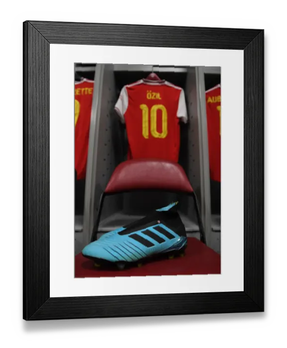 Framed Print : Arsenal's Mesut Ozil Prepares for Colorado Rapids Match: A Glimpse into the Arsenal Dressing Room Framed Print : Arsenal's Mesut Ozil Prepares for Colorado Rapids Match: A Glimpse into the Arsenal Dressing Room