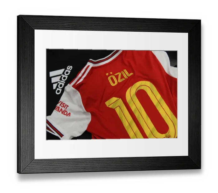 Framed Print : Arsenal FC: Mesut Ozil's Jersey in Arsenal Changing Room before Colorado Rapids Match