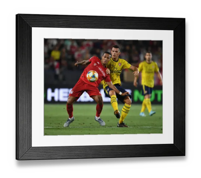 Framed Print : Arsenal vs. Bayern Munich: Granit Xhaka Tackles Coman in Intense International Champions Cup Clash Framed Print : Arsenal vs. Bayern Munich: Granit Xhaka Tackles Coman in Intense International Champions Cup Clash