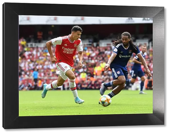 Arsenal vs. Olympique Lyonnais: Gabriel Martinelli Clashes with Jason Denayer at the Emirates Cup