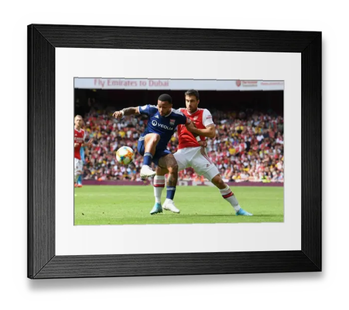 Framed Print : Arsenal vs. Olympique Lyonnais: Sokratis vs. Mephis Depay Clash at the Emirates Cup Framed Print : Arsenal vs. Olympique Lyonnais: Sokratis vs. Mephis Depay Clash at the Emirates Cup