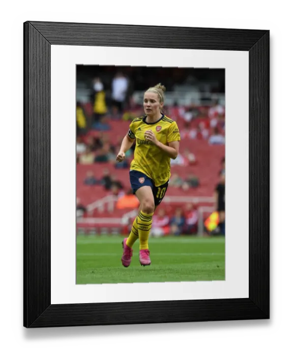 Framed Print : Arsenal's Kim Little Faces Off Against FC Bayern Munich at Emirates Cup