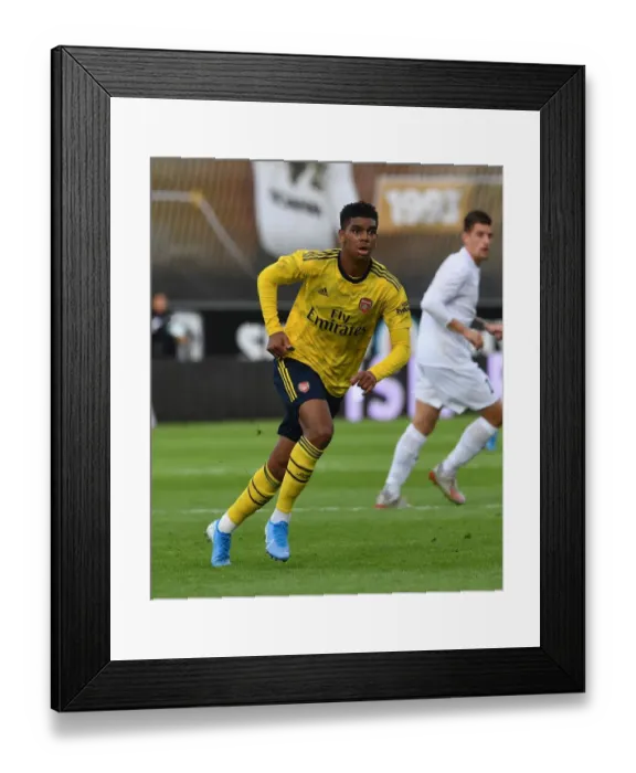 Framed Print : John-Jules Shines: Arsenal's Standout Performance in Angers Friendly