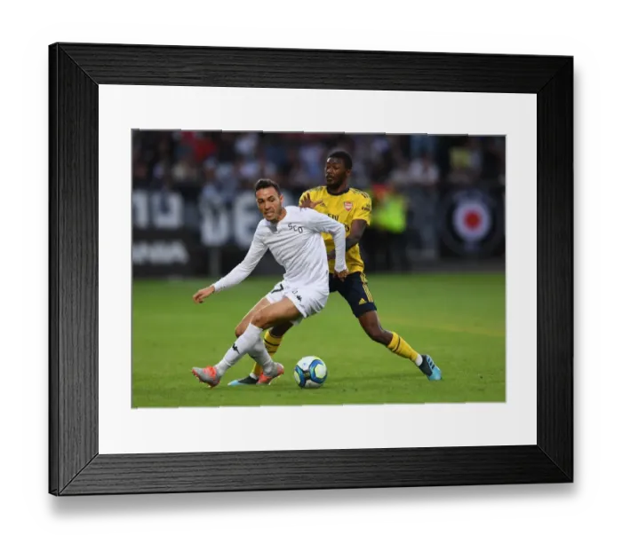 Framed Print : Arsenal's Ainsley Maitland-Niles Closes Down Angers Rachid Alioui in Pre-Season Friendly Framed Print : Arsenal's Ainsley Maitland-Niles Closes Down Angers Rachid Alioui in Pre-Season Friendly