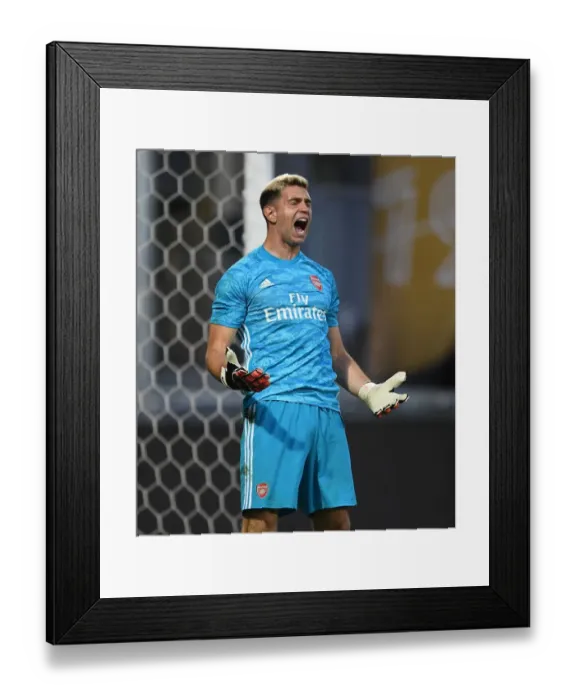 Framed Print : Emi Martinez Saves Penalty in Thrilling Angers vs. Arsenal Pre-Season Shootout