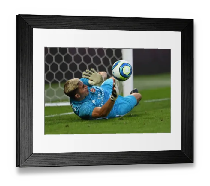 Framed Print : Arsenal's Emi Martinez Stops Penalty in Angers Friendly Framed Print : Arsenal's Emi Martinez Stops Penalty in Angers Friendly