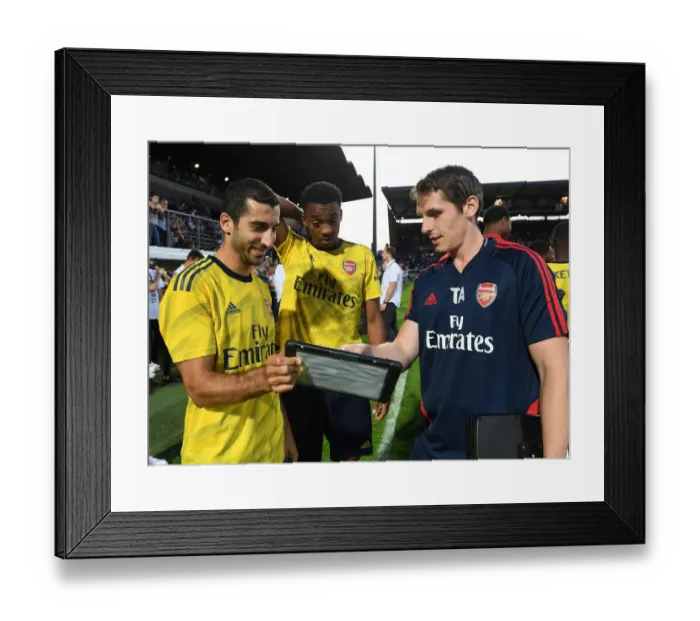 Framed Print : Arsenal Players Mkhitaryan and Willock Review Match Stats (Angers Friendly 2019) Framed Print : Arsenal Players Mkhitaryan and Willock Review Match Stats (Angers Friendly 2019)