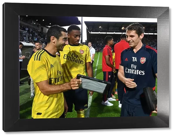 Arsenal Players Mkhitaryan and Willock Review Match Stats with Sports Scientist Allen