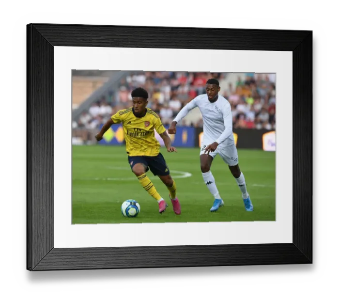 Framed Print : Reiss Nelson Faces Off Against Jeff Reine-Adelaide in Angers vs Arsenal Pre-Season Clash