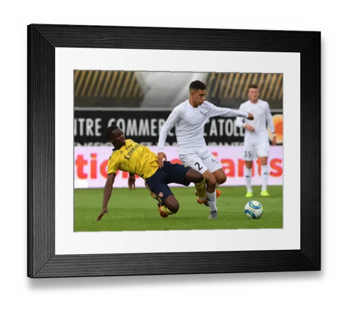 Framed Print : Angers vs Arsenal: Nketiah Clashes with Ait Nouri in Pre-Season Friendly