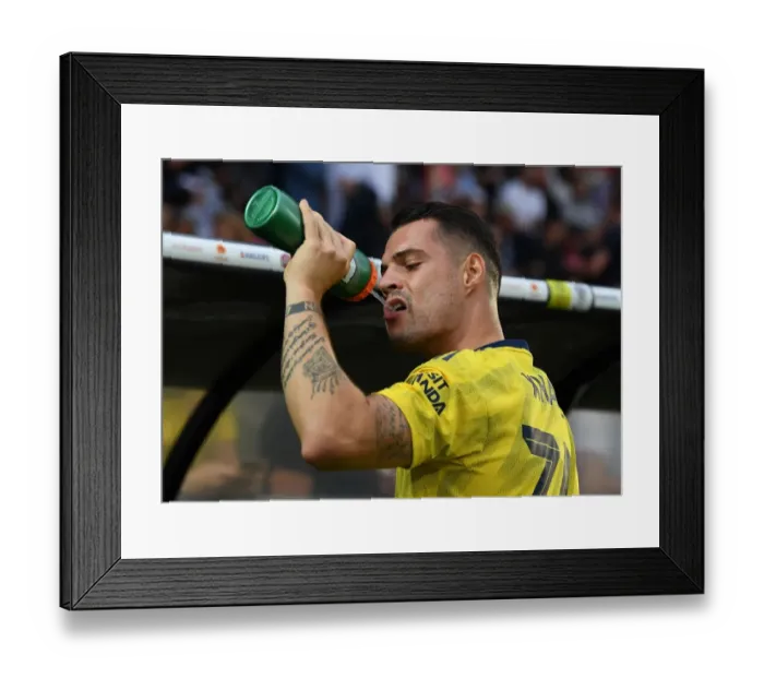 Framed Print : Granit Xhaka Gears Up: Arsenal's Pre-Season Encounter with Angers, France (July 2019)