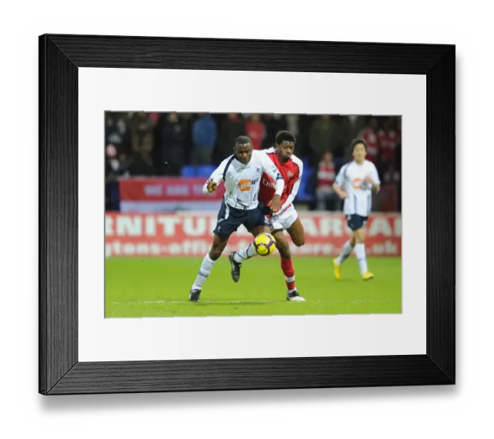 Framed Print : Abou Diaby (Arsenal) Fabrice Muamba (Bolton). Bolton Wanderers 0: 2 Arsenal