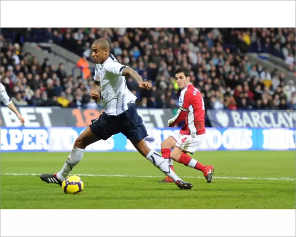 Cesc Fabregas shoots past Zat Knight to score the 1st Arsenal goal. Bolton Wanderers 0