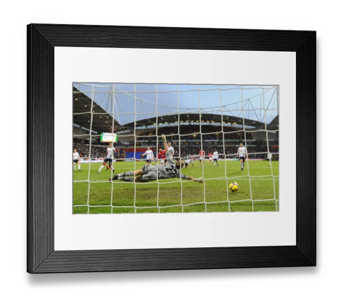 Framed Print : Cesc Fabregas shoots past Bolton goalkeeper Jussi Jskelainen to score the 1st Arsenal goal