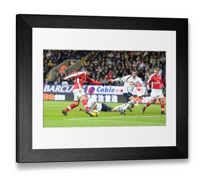 Framed Print : Fran Merida shoots past Bolton goalkeeper Jussi Jskelainen to score the 2nd Arsenal goal Framed Print : Fran Merida shoots past Bolton goalkeeper Jussi Jskelainen to score the 2nd Arsenal goal