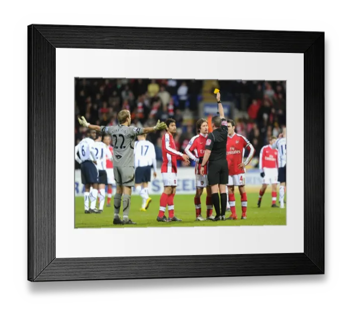 Framed Print : Referee Phil Dowd shows the yellow card to Arsenals Tomas Rosicky