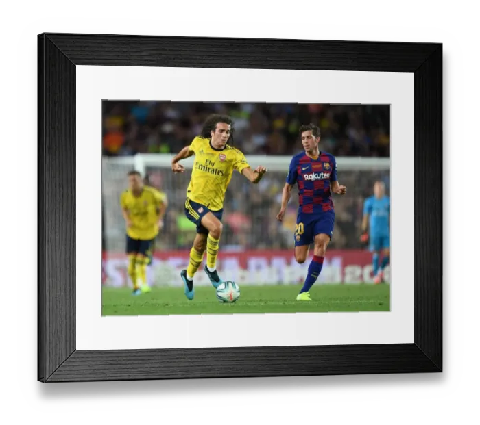 Framed Print : Guendouzi vs. Sergi Roberto: A Clash of Midfield Titans in FC Barcelona vs. Arsenal Pre-Season Clash at Nou Camp (2019)