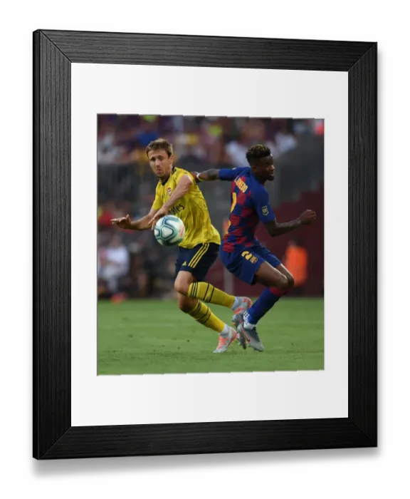 Framed Print : Nacho Monreal vs Semedo: A Clash of Titans in FC Barcelona vs Arsenal Pre-Season Friendly (2019)