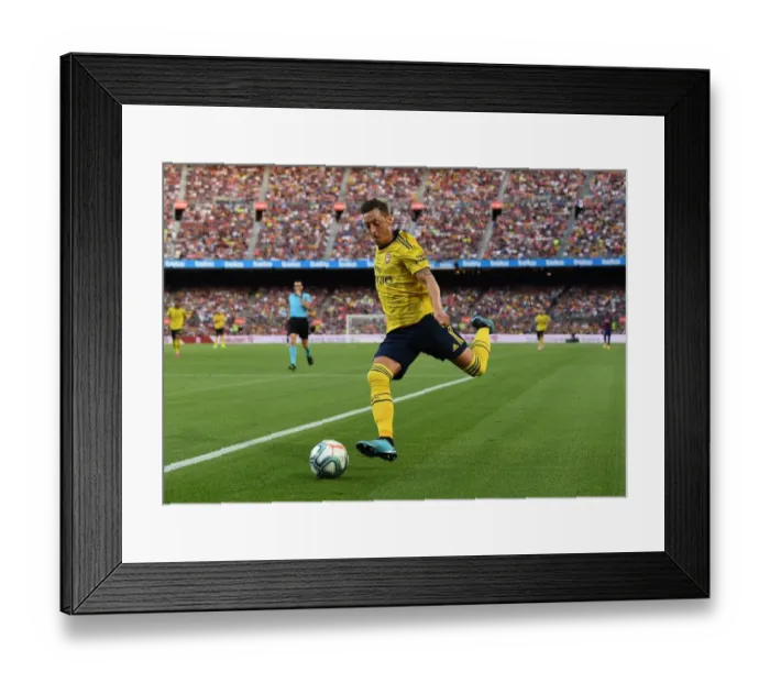 Framed Print : Mesut Ozil in Action: Arsenal vs. FC Barcelona, 2019 - The Thrilling Pre-Season Clash in Barcelona