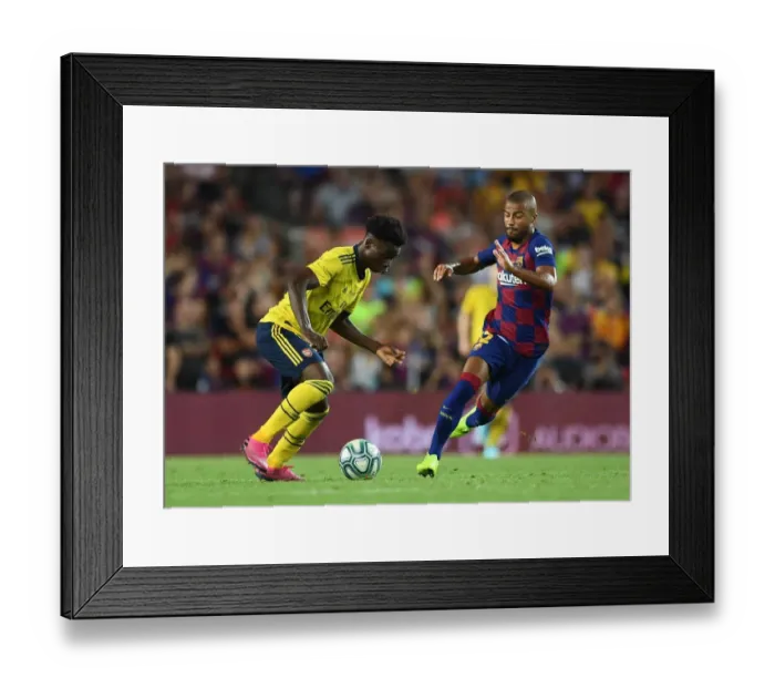 Framed Print : Bukayo Saka vs Rafinha: FC Barcelona vs Arsenal Pre-Season Clash at Nou Camp (2019-20)